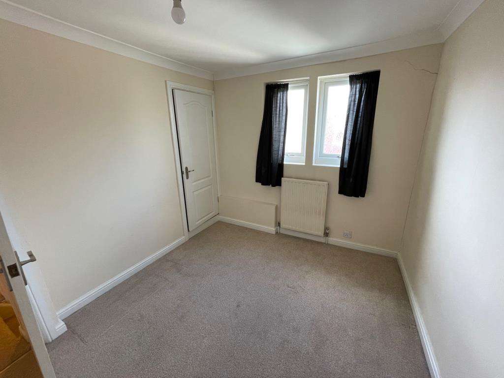 Lot: 107 - TWO-BEDROOM TERRACE HOUSE - Bedroom 2 with windows to rear and cupboard